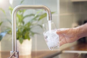 filling up a drinking glass-withsoft water that has been filtered